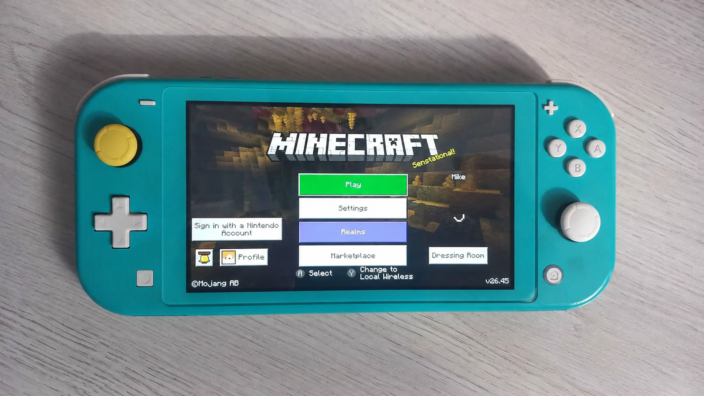 Nintendo Switch Lite бирюзовая + чехол + 8 игр image 0