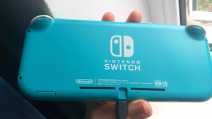 Nintendo Switch Lite бирюзовая + чехол + 8 игр image 1 blur bg
